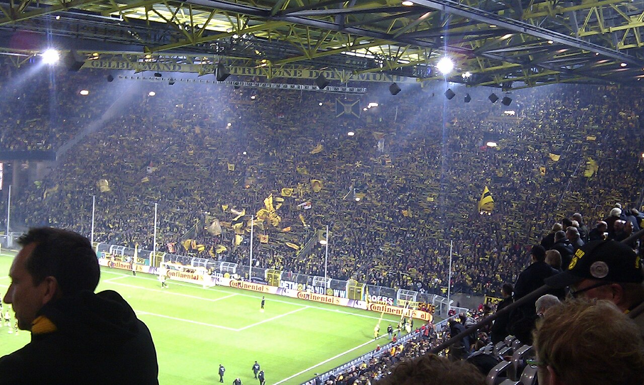 The Südtribüne standing terrace at Signal Iduna Park packed with Borussia Dortmund supporters in yellow