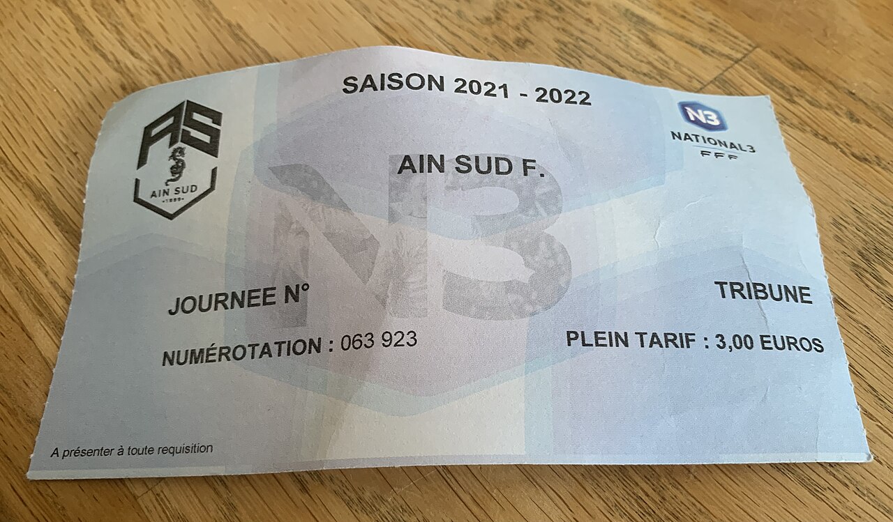 A printed football match ticket for a French fifth-tier fixture, photographed flat